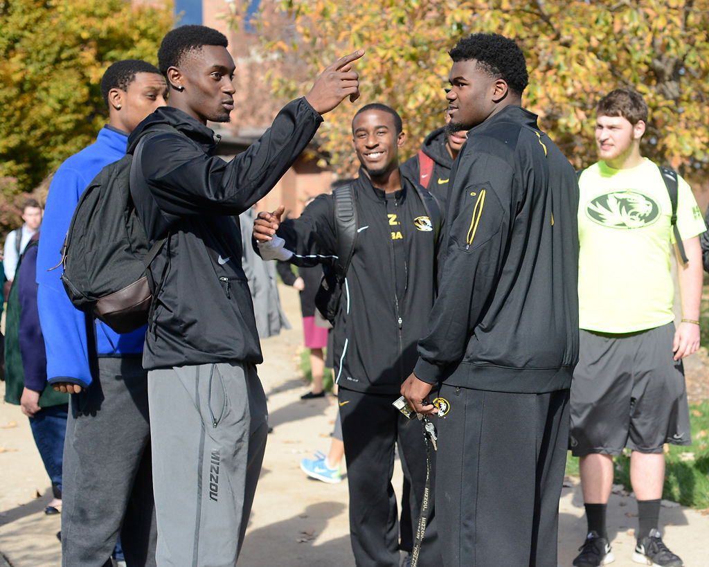Football players talk after attending walkout